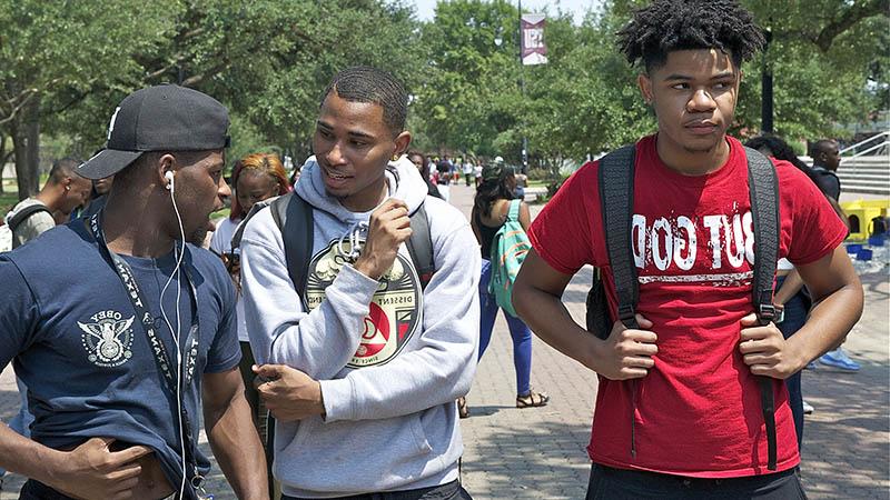 Male students walking on campus